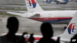 马来西亚航空公司停在吉隆坡国际机场停机坪上的飞机 （资料照片）