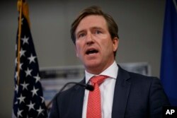 FILE - The U.S. Department of Homeland Security's Christopher Krebs speaks during a news conference on election cybersecurity, Oct. 19, 2018, in Arlington, Va.