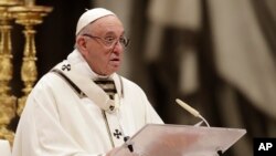 Pope Francis delivers his message as he celebrates the Christmas Eve Mass in St. Peter's Basilica at the Vatican, Monday, Dec. 24, 2018.