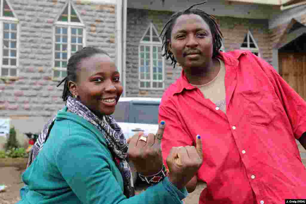 Voters in Dagoretti show the marks on their fingers that indicate they cast ballots during Kenya’s re-run presidential election, Oct. 26, 2017.