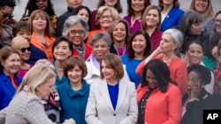 House Speaker Nancy Pelosi of Calif. arrives for a group photo with the House Democratic women members of the 116th Congress on the East Front Capitol Plaza on Capitol Hill in Washington, Jan. 4, 2019, as the 116th Congress begins.