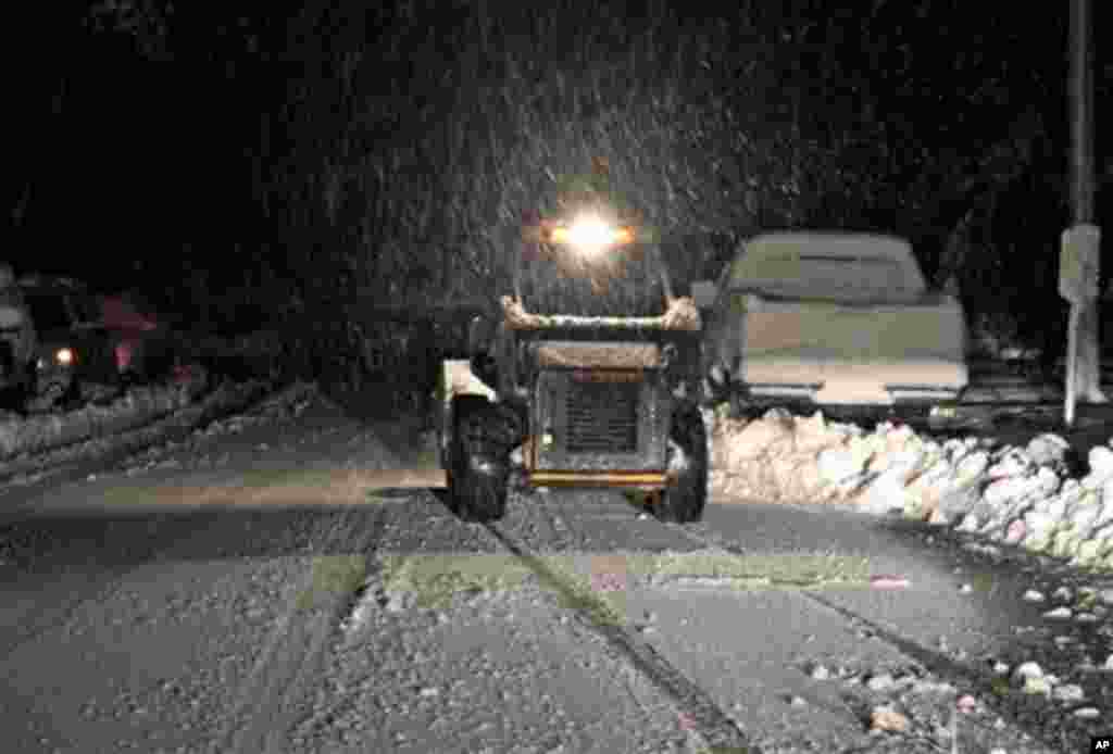 Snow falls in Elkins, West Virginia on Tuesday, Oct. 30, 2012, a day after Sandy slammed the eastern coast of the Unites States. In some parts of West Virginia, the collision of multiple storm systems could produce up to 3 feet of snow. 