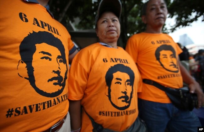Supporters wear T-shirts with the image of Thailand's Future Forward Party leader Thanathorn Juangroongruangkit before his arrival at a police station Bangkok, Thailand, April 6, 2019.