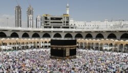 FILE - Muslim pilgrims perform the final walk around the Kaaba (Tawaf al-Wadaa), Islam's holiest shrine, at the Grand Mosque in Saudi Arabia's holy city of Mecca on August 13, 2019.