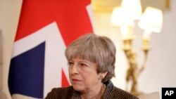 FILE - British Prime Minister Theresa May is seen during a meeting at 10 Downing Street in London, Britain, Nov. 27, 2017. 