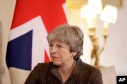 FILE - British Prime Minister Theresa May is seen during a meeting at 10 Downing Street in London, Britain, Nov. 27, 2017.