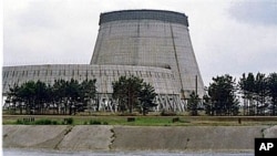 Reactor No. 4 of the Chernobyl nuclear power plant stands encased in lead and concrete following the April 1986 accident, which released a cloud of radiation that circled the world in Pripyat, 1988 (file photo)