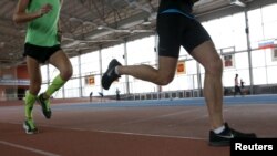 FILE - Athletes train at the Brothers Znamensky Olympic Center in Moscow, Russia, Nov. 10, 2015. Russian Olympic Committee president Alexander Zhukov issued a statement confirming that "clean" athletes would appeal the IAAF ban.