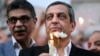 FILE - Yehia Qalash, the head of the journalists' union, holds a candle during a candlelight vigil for the victims of EgyptAir flight 804 in front of the Journalists' Syndicate in Cairo, May 24, 2016.