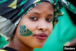 An African National Congress (ANC) supporter arrives at a memorial service for Winnie Madikizela-Mandela at Orlando Stadium in Johannesburg's Soweto township, South Africa, April 11, 2018.