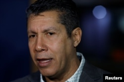 Venezuelan opposition politician Henri Falcon speaks during a meeting with representatives of international media in Caracas, Venezuela, Feb. 20, 2018.
