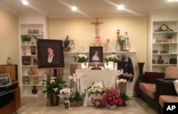 A memorial is displayed in the family home of Tin Nguyen in Anaheim, Calif., Dec. 5, 2015.