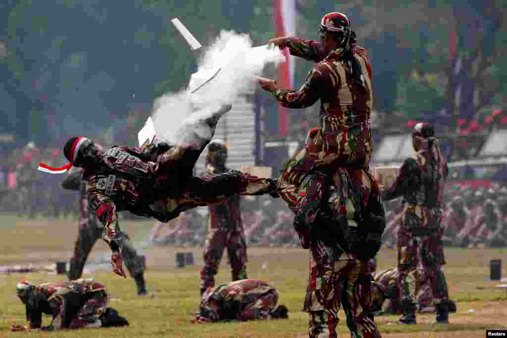 Soldiers perform martial arts during celebrations for the 67th anniversary of the Indonesian Army Special Forces in Jakarta.