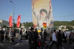 A stampede at a religious festival attended by tens of thousands of ultra-Orthodox Jews in northern Israel killed at least 45 people and injured more than 150 others early Friday. (AP Photo/Sebastian Scheiner)