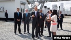 President Barack Obama tosses a Soccket ball in the air at the Ubongo Power Plant in Dar es Salaam, Tanzania, July 2, 2013. 