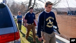Students leave the campus of the Franklin Regional School District after more then a dozen students were stabbed by a knife-wielding suspect at nearby Franklin Regional High School in Murrysville, Pennsylvania, near Pittsburgh, April 9, 2014.