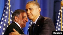 FILE - President Barack Obama (R) and then U.S. Secretary of Defense Leon Panetta are seen together at the National Defense University in Washington, December 2012.