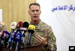U.S. Army Colonel Ryan Dillon, spokesman for Operation Inherent Resolve, the U.S.-led coalition against the Islamic State group, speaks during a press conference in Baghdad, Iraq, Aug. 24, 2017.