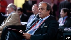 FILE - Now suspended UEFA chief Michel Platini is seen at the preliminary draw for the 2018 soccer World Cup, in Konstantin Palace in St. Petersburg, Russia, July 25, 2015.
