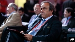 FILE - UEFA President Michel Platini waits for the beginning of the preliminary draw for the 2018 soccer World Cup in Konstantin Palace in St. Petersburg, Russia, July 25, 2015.