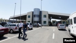 The European Border and Coast Guard Agency known as FRONTEX police patrol the area near Albania-Montenegro Crosspoint in Shkodra, Albania, June 6, 2018.