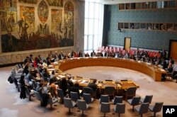 Members of the U.N. Security Council gather inside the United Nations Security Council chambers for a meeting on Syria, April 30, 2019.