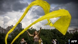 A participant flies a kite during the 'Letatlin N4' annual Festival of Kites, in Moscow, Russia, June 6, 2021.