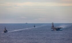 Japan Maritime Self-Defense Force training ships JS Kashima and JS Shimayuki conduct a passing exercise (PASSEX) with Nimitz-class nuclear-powered aircraft carrier USS Ronald Reagan in the South China Sea, July 7, 2020.