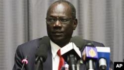 South Sudan Information Minister Michael Makuei, shown here at a news conference in Addis Ababa in January 2014, says the government will take part in South Sudan peace talks "up to the end."