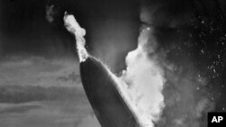 FILE - The German dirigible Hindenburg crashes in flames after exploding at the U.S. Naval Station in Lakehurst, N.J., May 6, 1937. The last of the 62 passengers and crew who survived the crash has died.