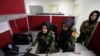From left, Second Lieutenant Roshan Gul, First Lieutenant Nelofar Frotan and Second Lieutenant Morsal Afshar work at the human resources office in the Ministry of Defense in Kabul, Afghanistan, Oct. 31, 2016. 