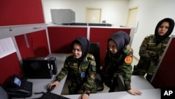 From left, Second Lieutenant Roshan Gul, First Lieutenant Nelofar Frotan and Second Lieutenant Morsal Afshar work at the human resources office in the Ministry of Defense in Kabul, Afghanistan, Oct. 31, 2016. 