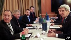 U.S. Secretary of State John Kerry (right) meets Russian Foreign Minister Sergey Lavrov on the sidelines of a Mediterranean Dialogues Summit in Rome, Dec. 2, 2016.