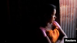 Một thiếu nữ Bangladesh 14 tuổi hành nghề mại dâm ở thành phố Faridpur, miền trung Bangladesh.
