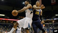 FILE - Minnesota Timberwolves center Ronny Turiaf (L) of France, pulls down a rebound against Utah Jazz center Derrick Favors (15) during the second quarter of an NBA basketball game in Minneapolis.