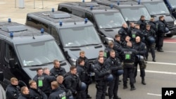 Police officers prepare for a rally in Chemnitz, eastern Germany, Sept. 1, 2018.