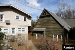 Homes are submerged after Coyote Creek flooded nearby neighborhoods and prompted an evacuation in San Jose, California, Feb. 22, 2017.