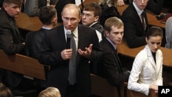 Russian Prime Minister Vladimir Putin speaks at a meeting with election monitors in Moscow, February. 1, 2012.