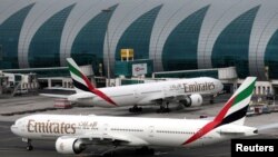 FILE: Emirates Airline Boeing 777-300ER planes are seen at Dubai International Airport in Dubai, United Arab Emirates. 2.15.2019