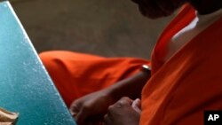 FILE - A prisoner sits during an interview with The Associated Press at James T. Vaughn Correctional Center in Smyrna, Delaware, Oct. 26, 2016.