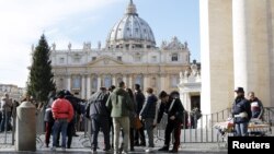 Tourists are inspected as they enter the Vatican in Rome, Italy, Nov. 22, 2015. Rome is bracing for the arrival of millions of pilgrims for the Roman Catholic Holy Year which officials had hoped could revitalize the scandal-plagued city, but which threatens to be more of a headache than a help.