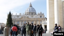 Tourists are inspected as they enter the Vatican in Rome, Italy, Nov. 22, 2015. 