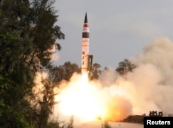 FILE -A surface-to-surface Agni V missile is launched from the Wheeler Island off the eastern Indian state of Odisha April 19, 2012. India test-fired the long range missile capable of reaching deep into China and Europe, thrusting the emerging Asian power into an elite club of nations with intercontinental nuclear weapons capabilities.