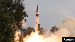 FILE - A surface-to-surface Agni V missile is launched from the Wheeler Island off the eastern Indian state of Odisha, Apr. 19, 2012. The missile, which can hit targets more than 5,000 kilometers away, effectively putting China's northernmost areas within range of Indian nuclear weapons. 