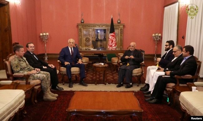FILE - Afghanistan's President Ashraf Ghani, right, and U.S. special envoy for peace in Afghanistan, Zalmay Khalilzad, left, meet in Kabul, Nov.10, 2018.