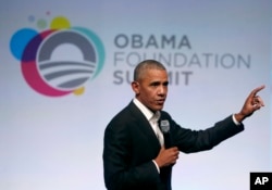 Former President Barack Obama addresses a crowd during the first session of the Obama Foundation Summit in Chicago, Oct. 31, 2017.