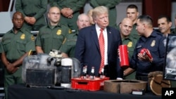 President Donald Trump is shown methods of narcotics smuggling during a tour of U.S. Customs and Border Protection Border equipment at their airport hanger at Marine Corps Air Station Yuma, Aug. 22, 2017, in Yuma, Arizona.