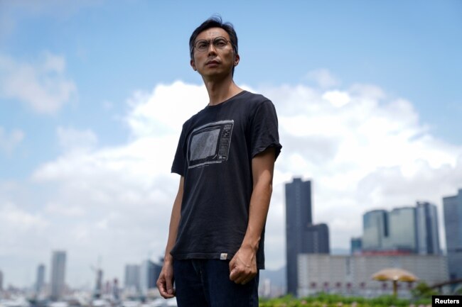 Documentary filmmaker Kiwi Chow, 42, poses for a photograph at Kwun Tong Ferry Pier near his studio in Hong Kong, China, June 18, 2021.