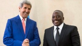 President of the Democratic Republic of Congo (DRC) Joseph Kabila (R) welcomes U.S. Secretary of State John Kerry at the Palais de la Nation in Kinshasa May 4, 2014. 