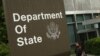 A woman leaves the U.S. State Department building in Washington June 5, 2009